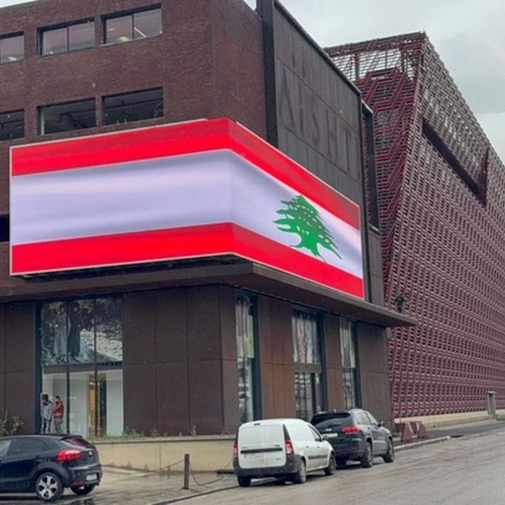 Corner building LED wrap showing a flag, Beirut