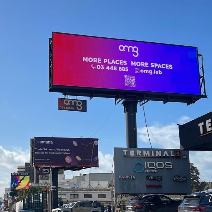 Outdoor LED billboard lit at dusk, Beirut