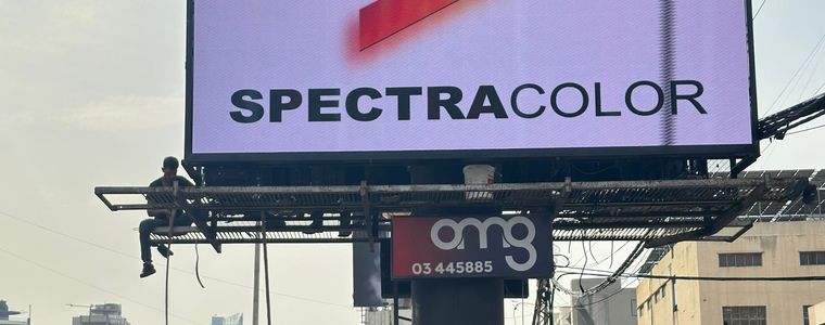 Outdoor LED billboard lit at dusk